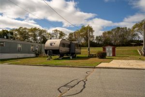 Meadowlark RV next to lot and mobile home
